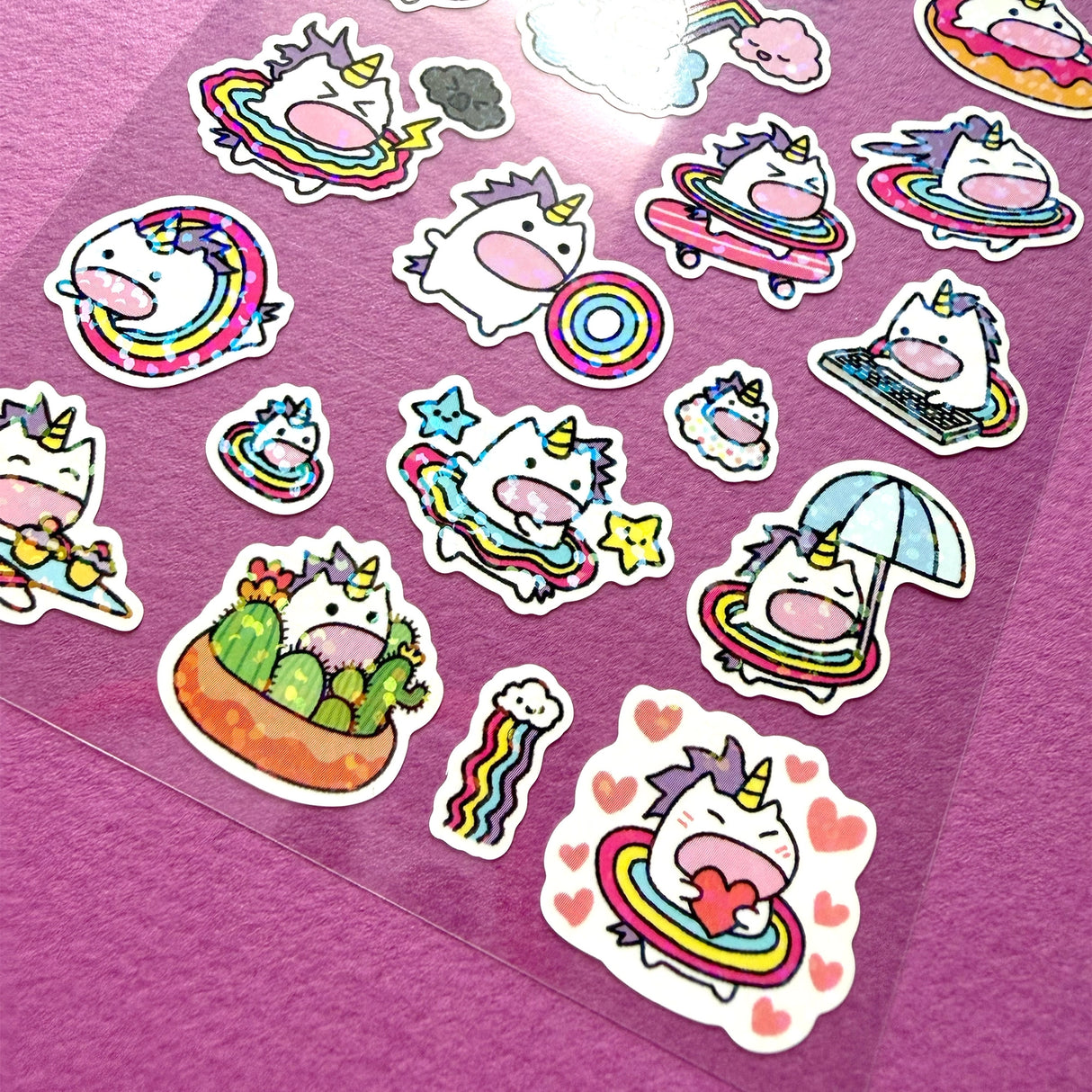 This is part of a new series of sticker sheets that feature different "days".
There are 24 individual stickers on the sheet full of dessert cuteness.
They are vinyl stickers on a clear plastic sheet with a backing card and packaging that's ready to display.
The whole packaging is 3.8 x 8.75" and is ready to hang. The sticker sheet is 3.75 x 5.8"