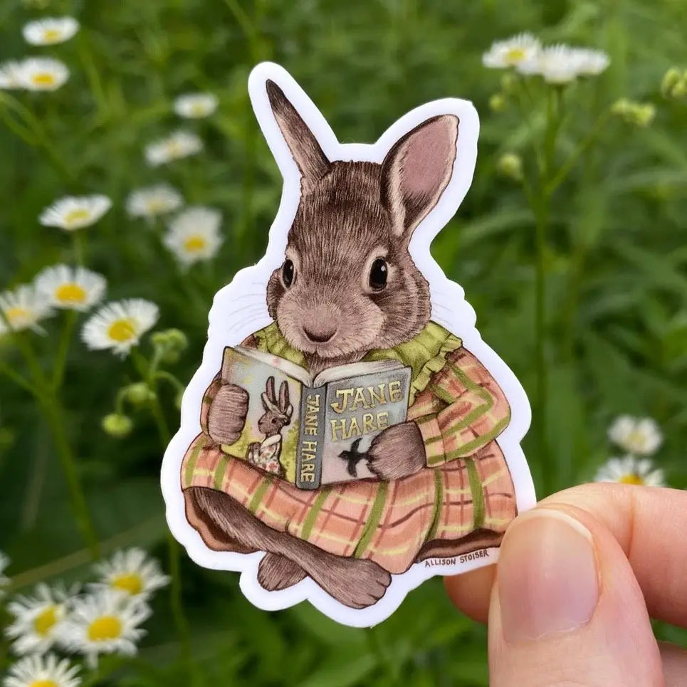 Allison Stoiser Art - Bookish Cottontail Rabbit Vinyl Sticker
This cottontail rabbit is settled in to read her favorite book of all time: Jane Hare!