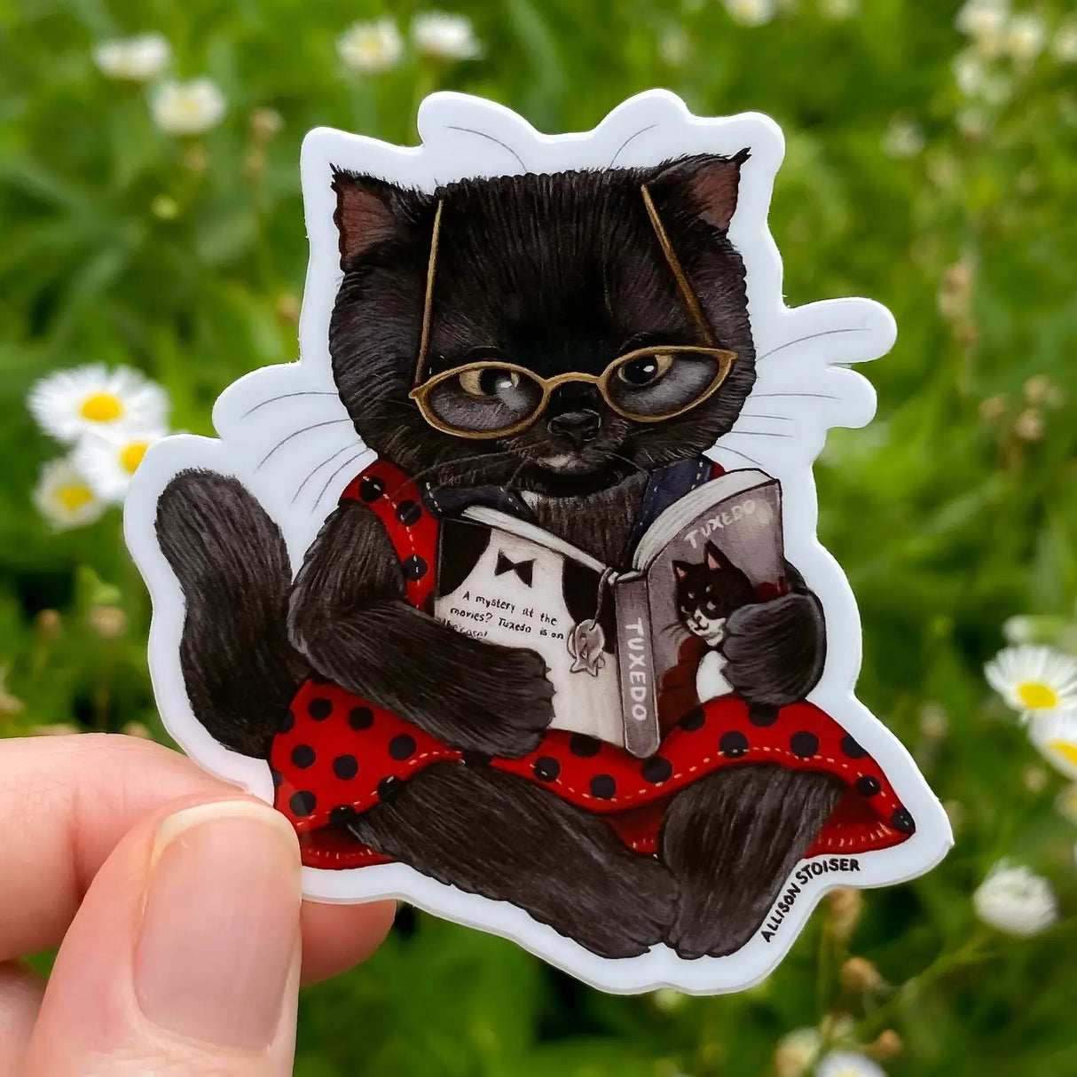 A mystery at the movies? This little black cat can't wait to see how Tuxedo, the famed feline detective, cracks this case!
This 2.5" die-cut gloss vinyl sticker is durable, weatherproof, and perfect for water bottles, notebooks, laptops, bikes, and all sorts of other surfaces! Make sure to clean and dry the surface thoroughly before applying.