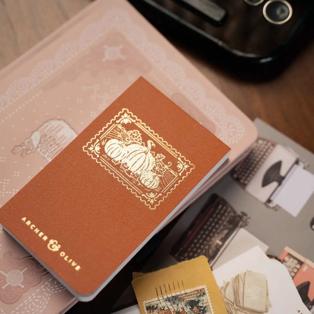 Capture fleeting thoughts, favorite quotes, and creative ideas with the Quiet Corners Memo Pad.
Wrapped in a beautiful buckram cover with elegant gold foil details, this compact memo pad is designed to stay close at hand whenever inspiration strikes.
Whether tucked into your bag or resting beside your journal, it's the perfect companion for writers, readers, and everyday note-takers.