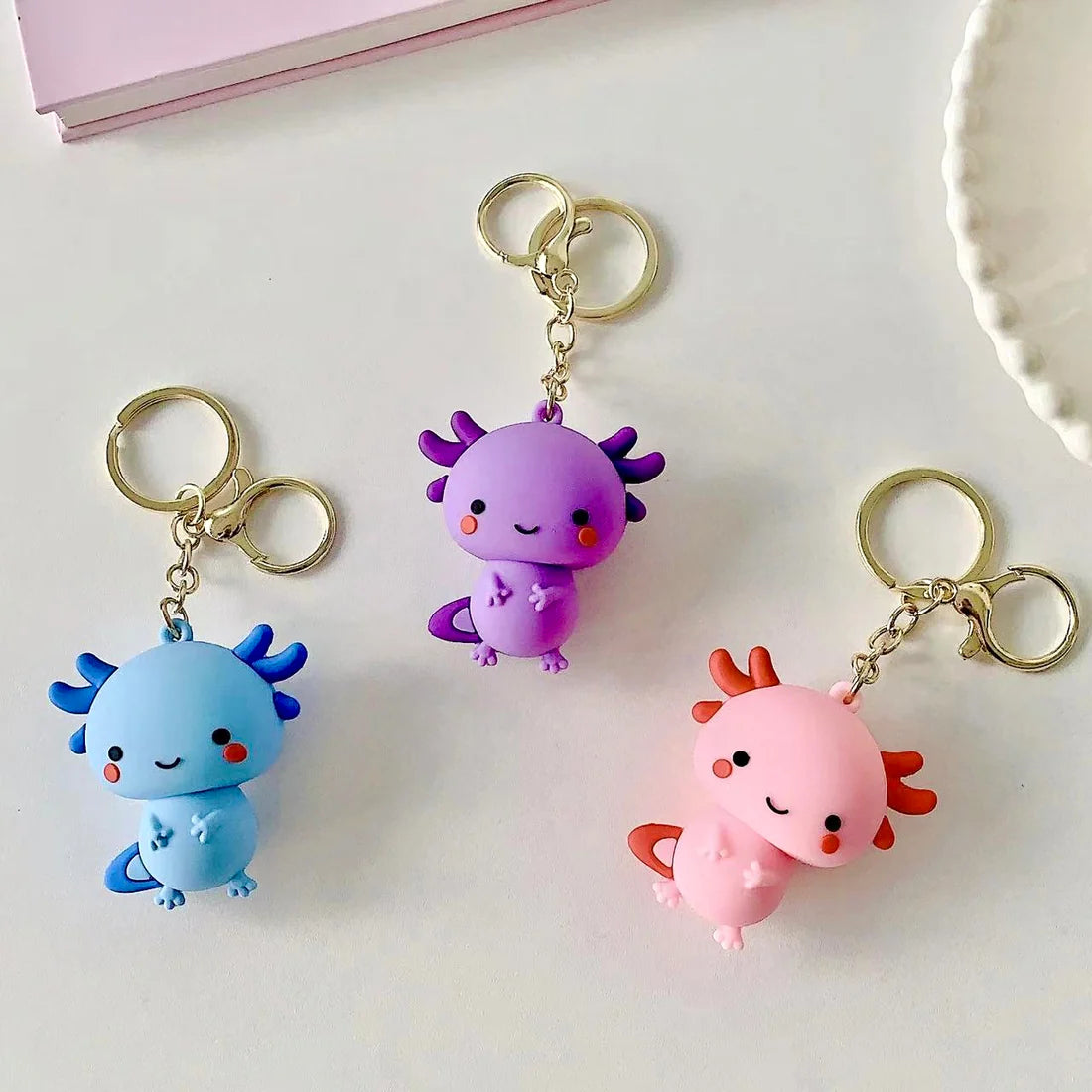 This adorable keychain adds personality wherever you go, whether clipped to your keys, bag, or backpack. Cute, lightweight, and easy to gift, it’s perfect for anyone who loves whimsical accessories or axolotl-themed goodies.