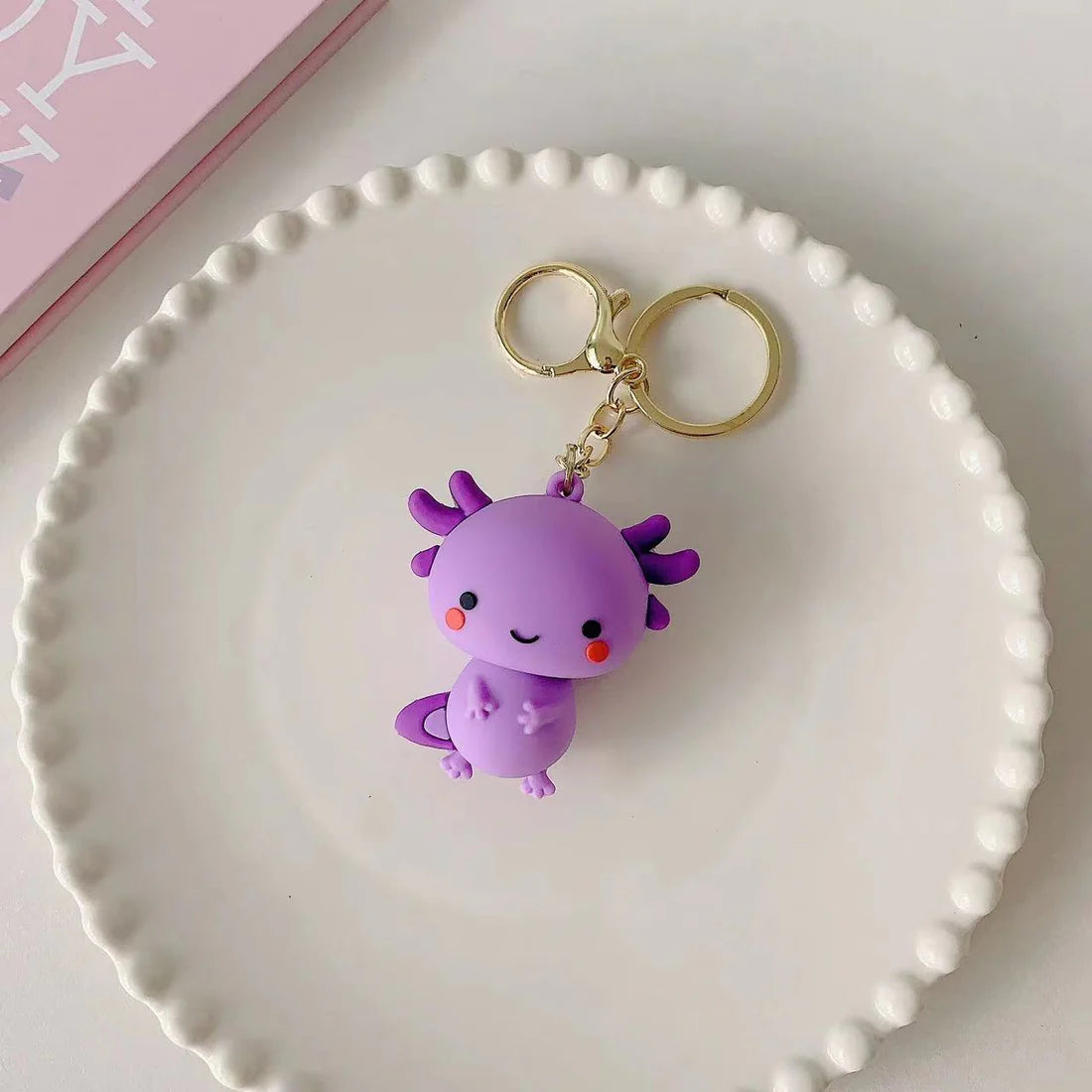 This adorable keychain adds personality wherever you go, whether clipped to your keys, bag, or backpack. Cute, lightweight, and easy to gift, it’s perfect for anyone who loves whimsical accessories or axolotl-themed goodies.