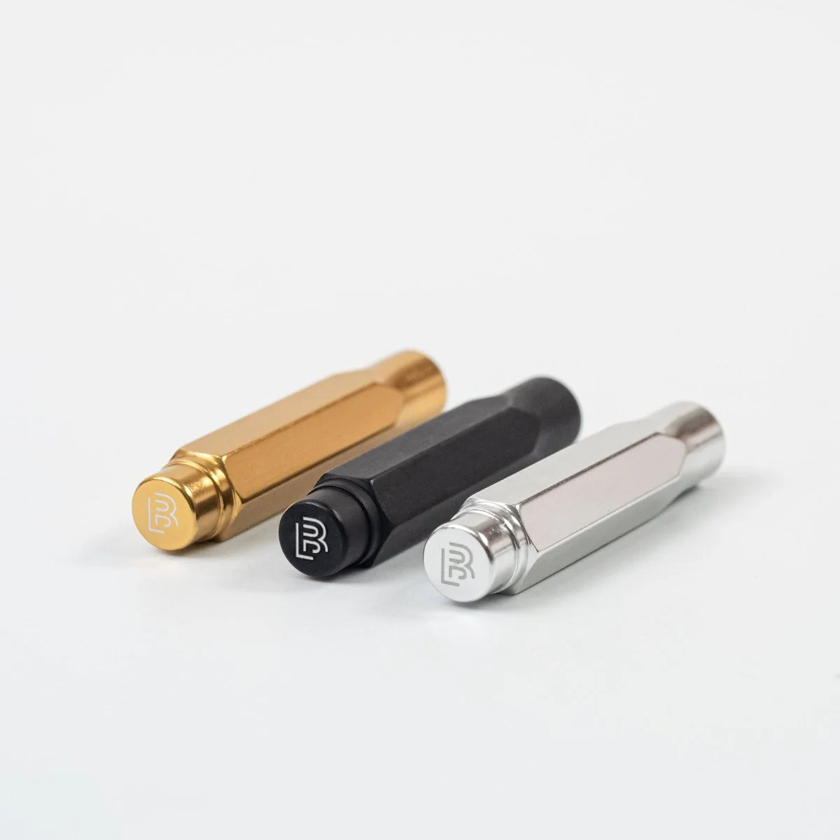 The Blackwing Point Guard is designed to ensure your Blackwing pencil gets wherever you’re going in one piece. Crafted out of lightweight, machined aluminum, the Point Guard goes over the point of your Blackwing pencil, keeping it safe in your bag, pocket, or pencil roll. The tip of your pencil “floats” inside the cap to protect your point against unexpected drops or jams.
Point Guards are available in matte black, matte white, bright gold, bright silver, or a mixed set of 3 (gold, silver, and black).