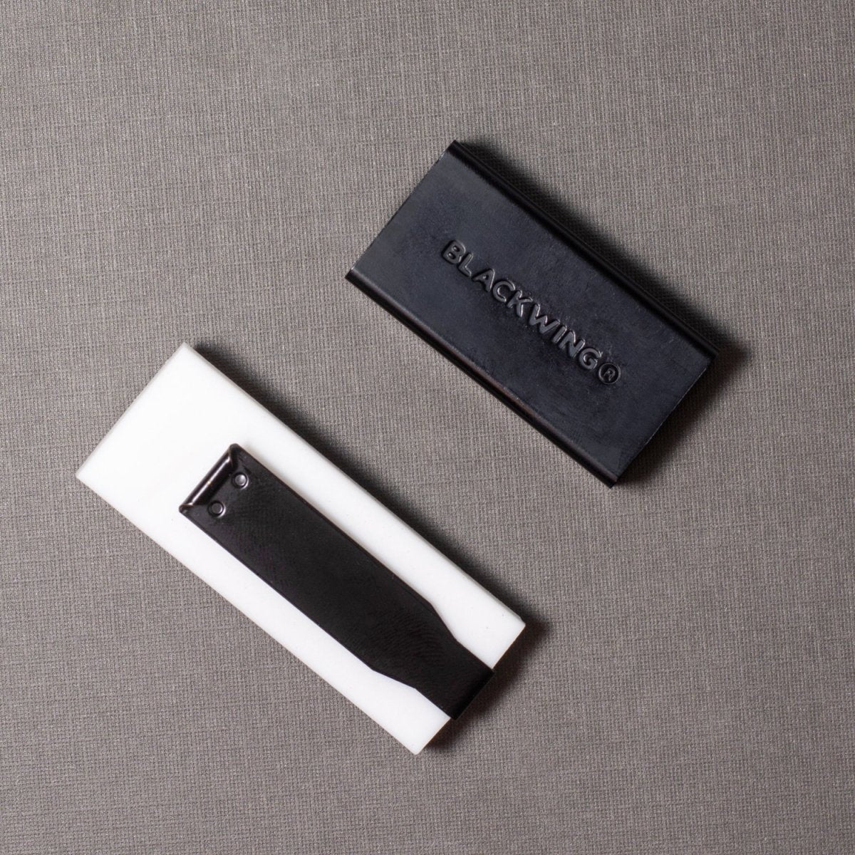 We took the iconic design of our eraser clip and adapted it into a sleek handheld form that feels great to use.
The eraser is made of a special soft material that erases the dark lines of our graphite cleanly and easily. The holder is made of durable aluminum that lets you get a solid grip while erasing. It also includes a jumbo-sized version of the iconic Blackwing clip, so you can extend the eraser as you use it.