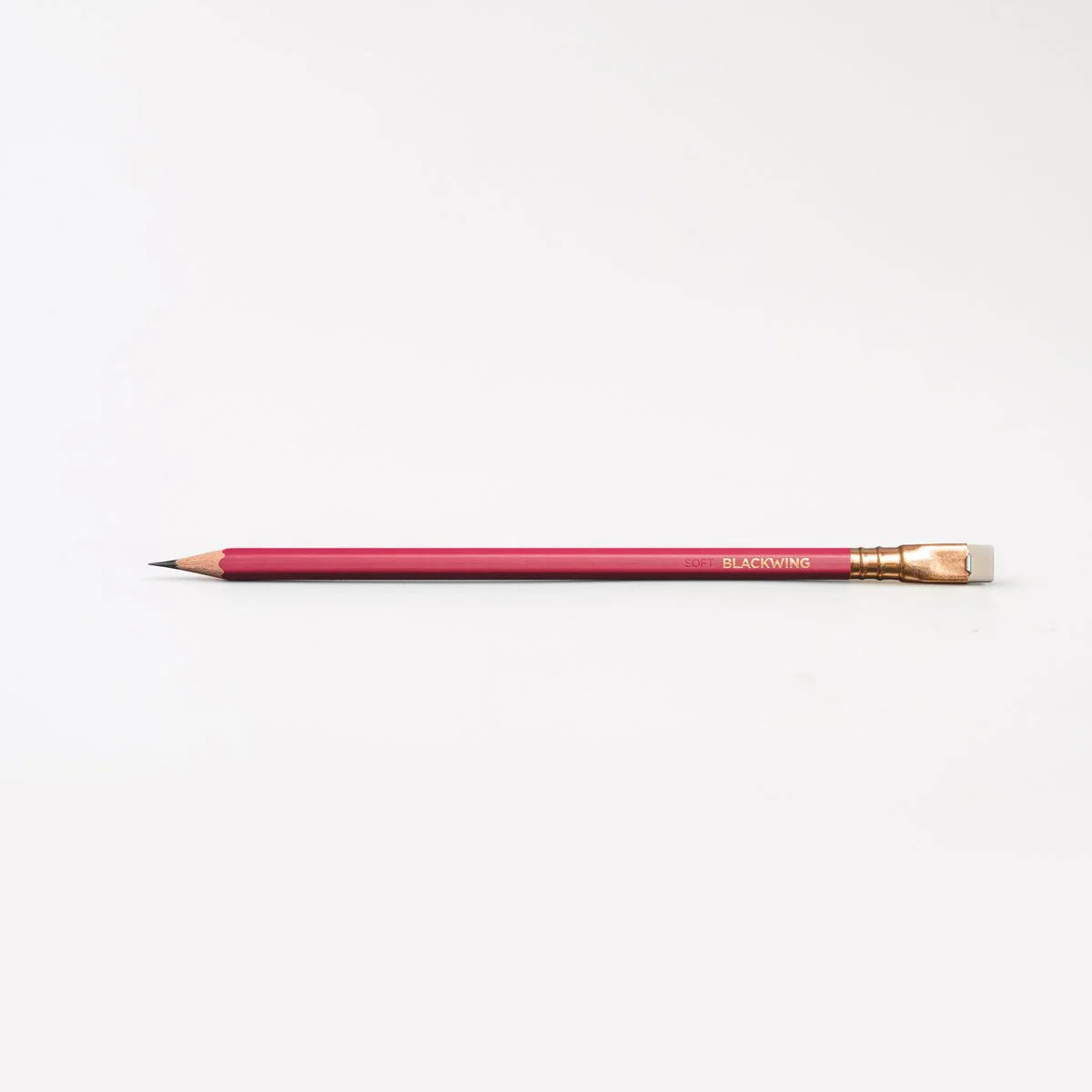 This colorway has a matte red finish, copper imprint, copper ferrule, and light gray eraser. It features a “SOFT” pencil graphite indicator stamp on the barrel. Not to be confused with our red core pencils, this is a graphite pencil with a red barrel. This pencil is ideal for musicians, woodworkers, and anyone who prefers a soft, dark graphite line. The Blackwing Matte is the softest of the four core Blackwing models.
Blackwing Matte pencils come in a 12-pack gift box that also doubles as a pencil cup. The