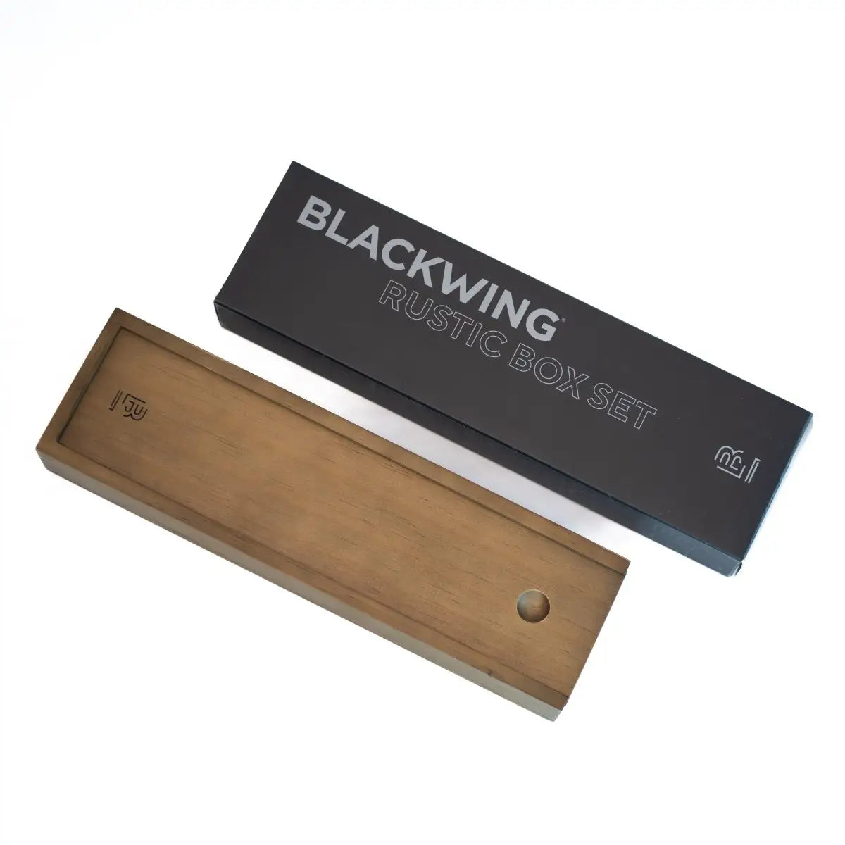 The Blackwing Rustic Box features your choice of 12 premium Blackwing graphite pencils and our reliable Two-Step Long Point Sharpener. Choose from 12 Matte pencils,12 602 pencils, 12 Pearl pencils, 12 Natural pencils, or 3 of each. The aged pine pencil box slides open to reveal the Blackwing pencils and a black cork-lined interior. The smooth stationery box is perfect for any workspace, office, or desk.
All Rustic Boxes now come with our Grey Two-Step Long Point Sharpener.
All Blackwing pencil products co