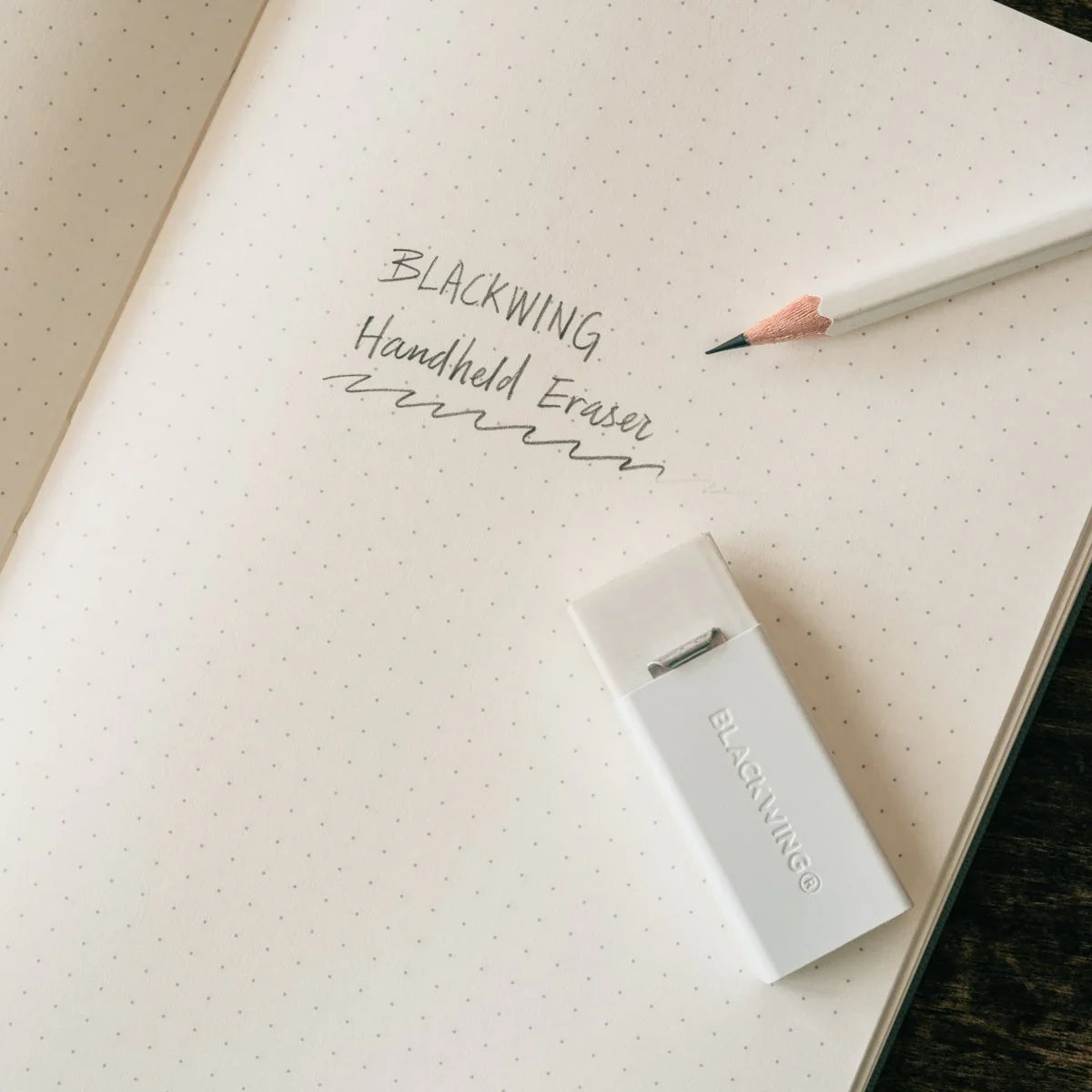 We took the iconic design of our eraser clip and adapted it into a sleek handheld form that feels great to use.
The eraser is made of a special soft material that erases the dark lines of our graphite cleanly and easily. The holder is made of durable aluminum that lets you get a solid grip while erasing. It also includes a jumbo-sized version of the iconic Blackwing clip, so you can extend the eraser as you use it.