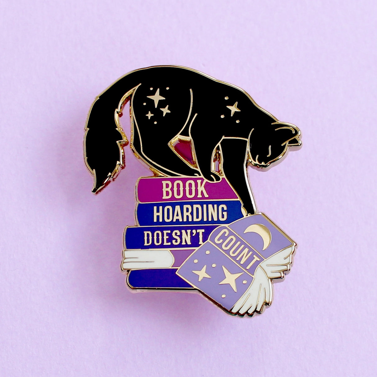 Everybody loves a neat and tidy space, but those groaning book shelves definitely don’t count!
This fab enamel pin is perfect for book lovers – either as a little treat for yourself, or a gift for the bookworm in your life.
Measurements: 43mm
