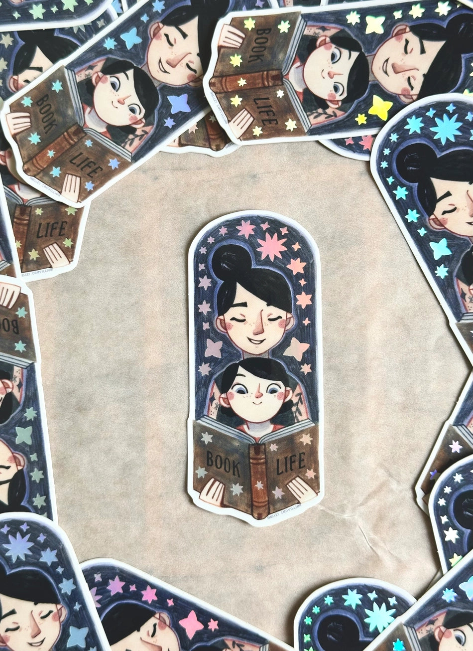 Bring the magic of storytime to life with our enchanting Mom and Kid Reading Sticker! Crafted with love and attention to detail, this holographic vinyl sticker captures a heartwarming scene of a mom and child engrossed in a book together that your customers will love!
Features: Size: 3.5 inches tall, 1.5 inches wide
Material: Premium vinyl with a captivating holographic finish