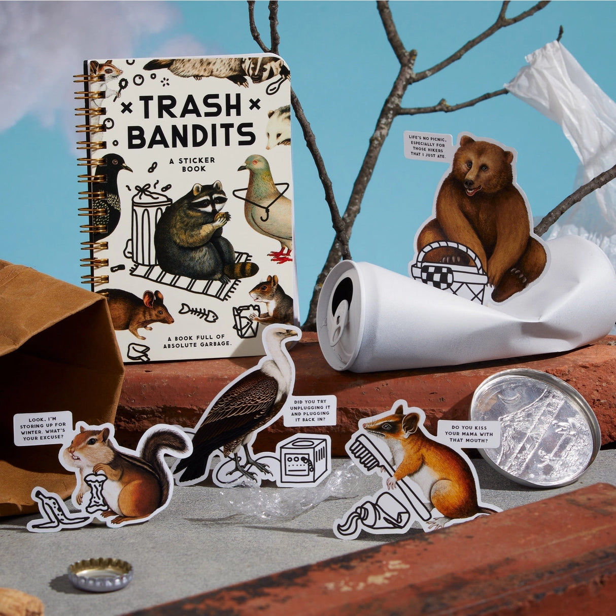 Dumpster chic meets unapologetic attitude in the Trash Bandits Sticker Book—a gloriously messy collection of oversized stickers featuring raccoons, possums, pigeons, and other urban icons with googly eyes and snarky commentary. Whether you're decorating your planner or marking your territory, these critters are here to add some trashy charm to your everyday life.
Inside, you’ll find 18 pages of trash animal stickers + 2 bonus pages of vintage-inspired puffy stickers, all packed with clever quips and chaoti