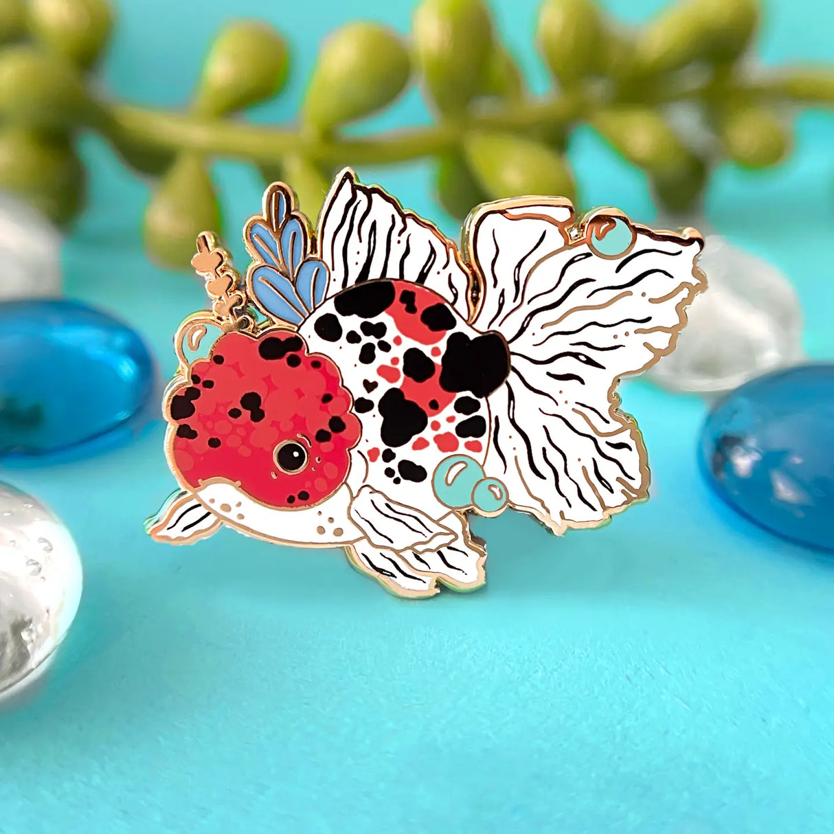 Celebrate your love for goldfish with this calico oranda pin!
✦ Hard enamel
✦ Shiny gold metal
✦ Screen-printed details
✦ 1.25 inches
✦ 2 Posts for extra security
✦ Rubber backings
✦ Back stamped for authenticity
Comes packaged on a backing card! 