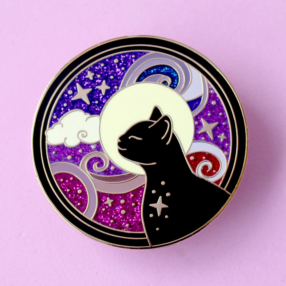 This amazing Cosmic Cat features a black cat against a celestial background, done in an Art Nouveau style. The purple and blue swirls are full of glitter – this fab pin is a real conversation starter!
The pin is secured by two purple heart backs and comes on a special ‘Art Nouveau’ Glitter Punk backing card, making it perfect for a gift or to keep as a special treat for yourself.
This pin is part of my Art Nouveau Cats collection – 8 enamel pins based on the fabulous 19th/20th century art movement.