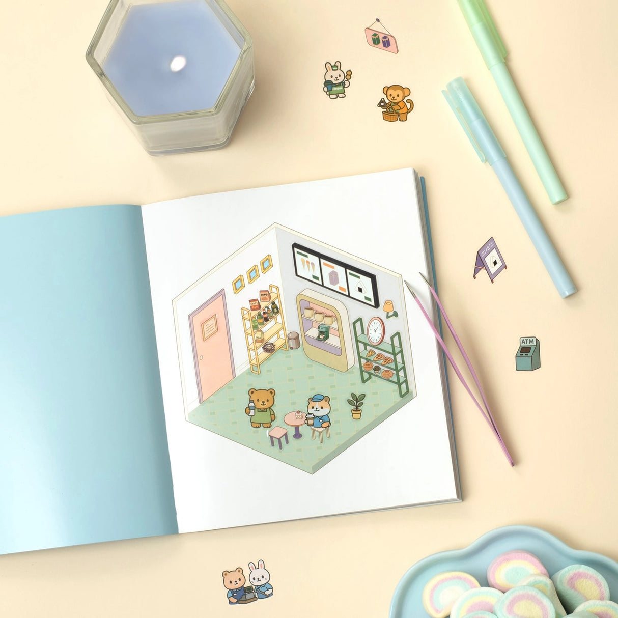 Create the coziest "konbini" convenience store imaginable, with six room sets and hundreds of stickers…
Welcome to a cozy world of absolute cuteness! Pick an empty space; furnish it, decorate it and fill it with furry little characters until it's a busy little convenience store. Then carry on until you've created your own unique keepsake: there are six to complete in this book!