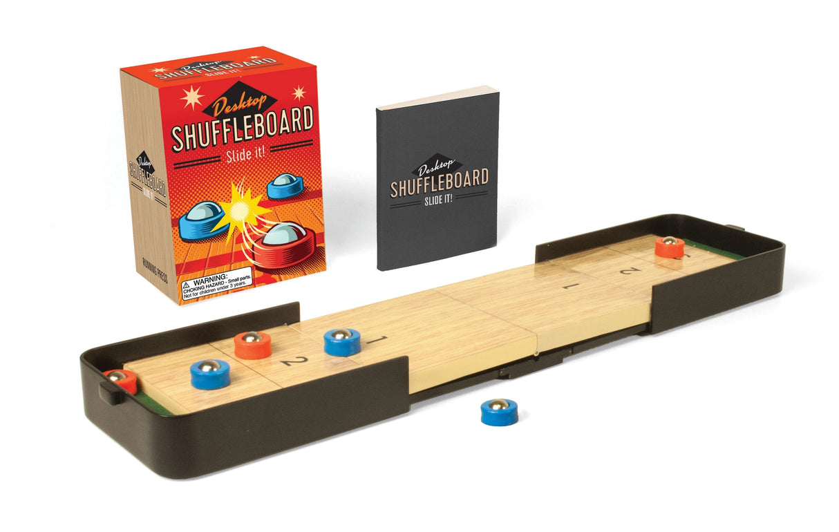 Desktop Shuffleboard serves as the perfect game night addition, travel game, or office distraction!
This portable miniature set includes:
12" extendable shuffleboard platform, with 2 table inserts
6 (3 red and 3 blue) weighted pucks
Shuffleboard stickers
32-page book with trivia and rules of desktop shuffleboard