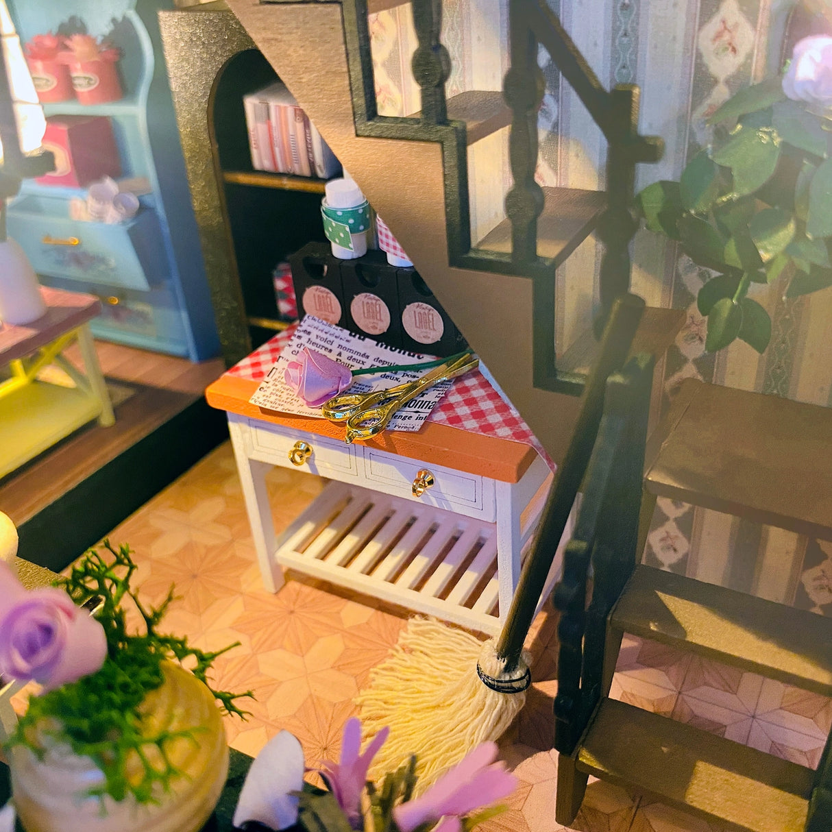 Escape into a peaceful retreat with this miniature kit-a dreamy blend of indoor charm and outdoor beauty. This cozy loft is a plant lover's paradise, filled with blooming flowers, lush greenery, and thoughtful touches of home. With a comfy sofa, a charming desk, and warm light that illuminates the space, it's the perfect hideaway for creativity and relaxation.
2 AAA batteries required; batteries are not included.
Age Range: 14+
Assembled Dimensions: 8.7 x 6.7 x 9.25 inches