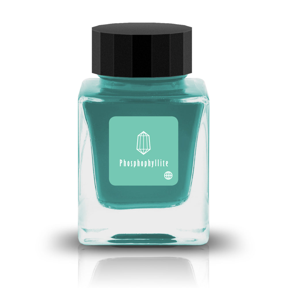 Phosphophyllite, from Tono & Lims’ Earth Contact Series, captures the radiant brilliance of the rare gemstone in ink form. Inspired by birthstones, this shimmering fountain pen ink contains fine glitter particles. Perfect for those who love bold and luminous colors, Phosphophyllite transforms each stroke into a sparkling display of depth and light. Be sure to shake the bottle well before use to evenly disperse the glitter.