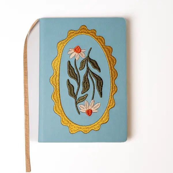 Embroidered Daisy Frame Hardbound Notebook
A premium hardcover notebook featuring precision embroidery on a vegan leather cover. Designed for everyday use, it includes smooth-lined pages, a Smythe-sewn layflat binding for effortless writing, and a satin ribbon to mark your place.
New inside page design
Soft Touch Embroidered Hardcover
5.75" x 8.25"
144 Lined Pages
Contrast Endpages
Satin Ribbon Bookmark & Pen Loop