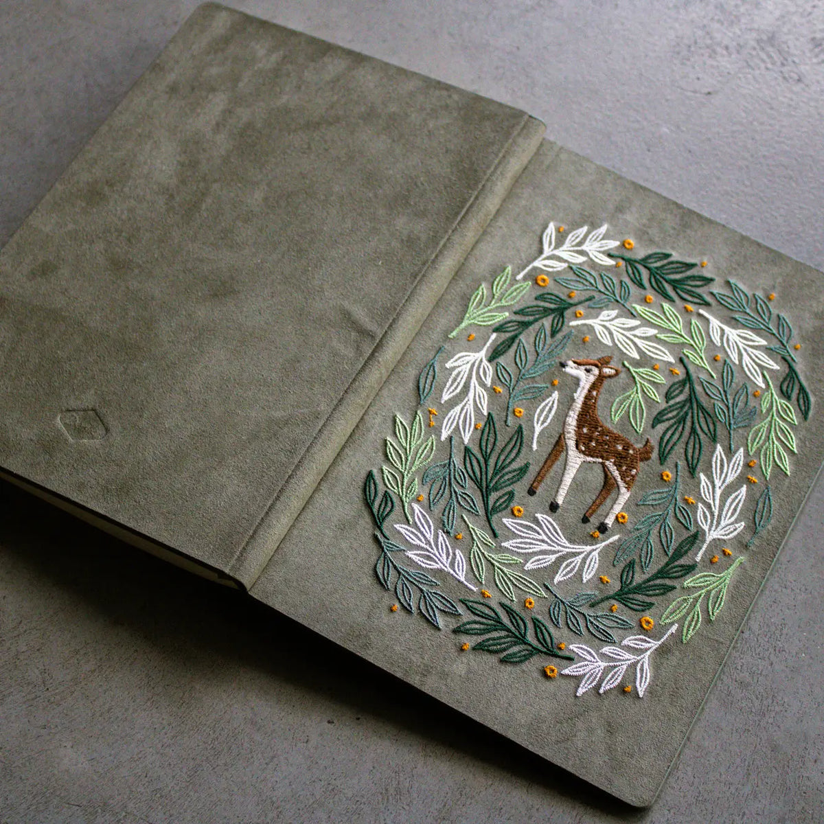 Embroidered Deer Hardbound Layflat Notebook
Premium embroidered cover and beautiful cream-colored lined pages making it easy to keep track of even the smallest details. Complete with a rich, satin ribbon allowing you to bookmark your favorite pages and experiences.
5.75" x 8.25" hardcover journal notebook
Embroidered cover artwork
144 lined pages
Glorious Smythe-sewn binding allows notebook to lay flat
Ribbon Bookmark
Durable binding and high-quality paper for a premium writing experience
Ideal for gifts,