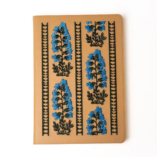 Embroidered Delphinium Flower Hardbound Notebook
A premium hardcover notebook featuring precision embroidery on a vegan leather cover. Designed for everyday use, it includes smooth-lined pages, a Smythe-sewn layflat binding for effortless writing, and a satin ribbon to mark your place.
New inside page design
Soft Touch Hardcover
5.75" x 8.25"
144 Lined Pages
Contrast Endpages
Satin Ribbon Bookmark & Pen Loop