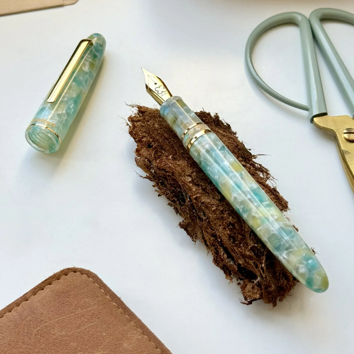 The Estie Sea Glass is inspired by the calming hues of the ocean, offering a serene writing experience with every use. Its smooth design and cool tones make it a unique addition to any collection, perfect for those who seek both tranquility and elegance in their writing tools.
The Esterbrook Estie features a German-manufactured nib by Jowo, known for its reliability and smooth performance. Each nib is carefully inspected by hand and marked with our logo and size indication for easy identification.
One of