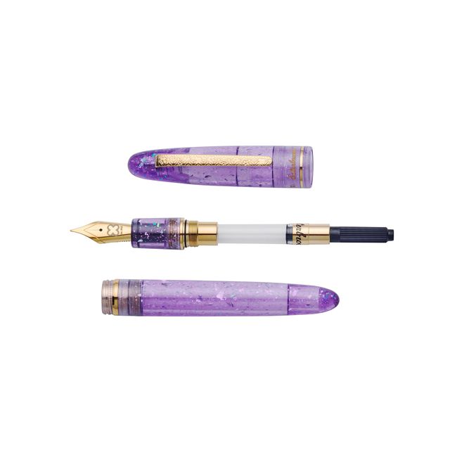 Esterbrook x Sakuradragon Sakura Street Estie Fountain Pen
Created with artist Cindy Duong of Sakuradragon, the Sakura Street Estie brings her imaginative illustrated world to Esterbrook's traditional Estie fountain pen. Its U.S.-blended material combines translucent purple with colorful glitter sparkle, while the custom clip is etched with Cindy's Sakura pattern. Dual Esterbrook and Sakuradragon engraving and a gold-plated converter finish the design. Each pen arrives in special packaging with Japanese gi