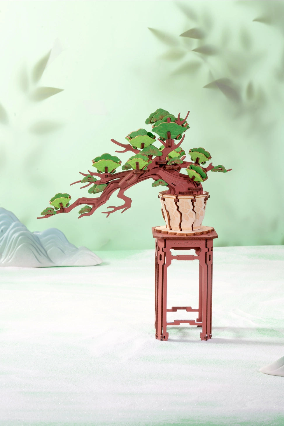 This intricately designed puzzle invites you to assemble a lush, detailed bonsai tree, capturing the essence of a peaceful, natural landscape. Each precision-cut wooden piece comes together effortlessly, allowing you to create a miniature masterpiece that symbolizes strength, resilience, and tranquility. Whether you're a puzzle lover, a fan of bonsai trees, or looking for a unique gift, this evergreen pine bonsai tree makes for a perfect addition to any collection.
With no glue or special tools required, t