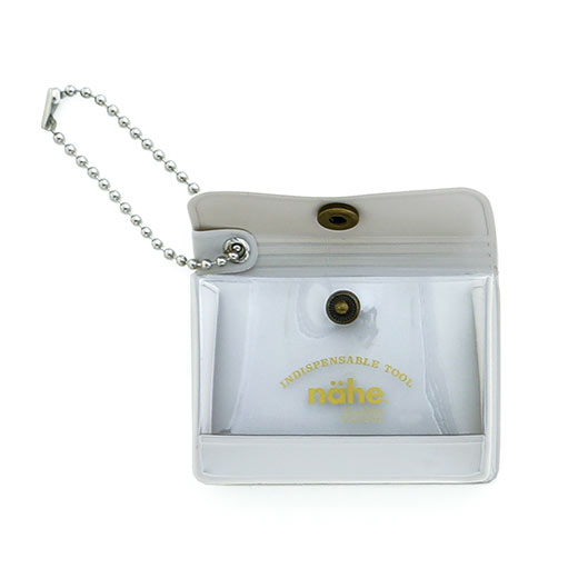 A miniature keychain version of the popular General Purpose Case by nähe. The true-to-original case comes with a clear front pocket with extra inserts inside and out. A ball chain securely attached to the corner of the case lets you hang it onto your keys or bags, perhaps in multiples.
Perfect size to travel with and quickly access your keys, coins, medicine, or small accessories. 