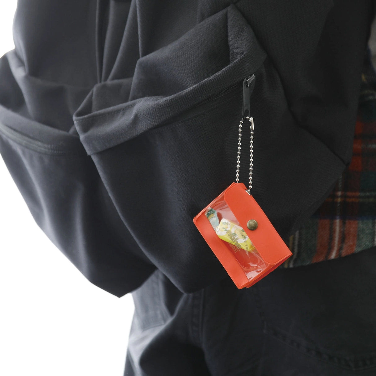 A miniature keychain version of the popular General Purpose Case by nähe. The true-to-original case comes with a clear front pocket with extra inserts inside and out. A ball chain securely attached to the corner of the case lets you hang it onto your keys or bags, perhaps in multiples.
Perfect size to travel with and quickly access your keys, coins, medicine, or small accessories. 