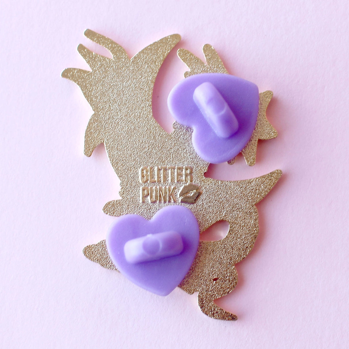 Glitter Punk - Celestial Dragon Enamel Pin
This fabulous starry Celestial Dragon pin is perfect for fans of the mythical!
Made from gold hard enamel, this 48mm purple dragon is surrounded with glittery clouds and a large gold crescent moon. It is secured with two purple heart rubber clasps.