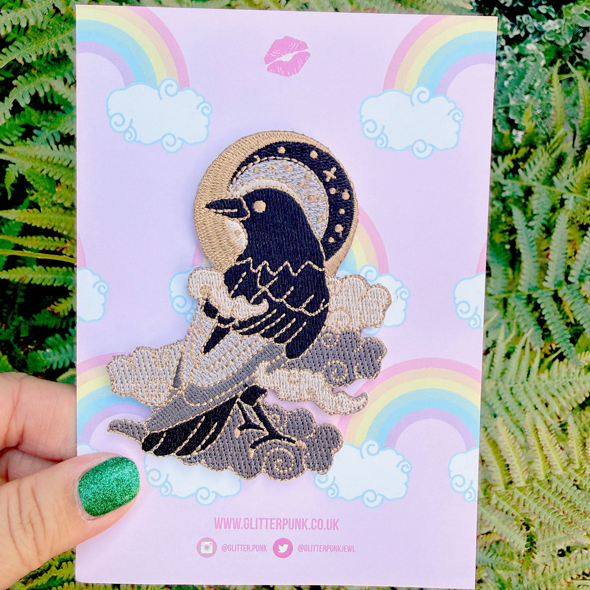 This fabulous patch features a black crow surrounded by grey glittery clouds, and a starry moon with grey backgrounds.
Beautifully woven with black, white, grey & gold threads, this fabulous patch with brighten up any coat, bag or hat!
Measurements: 70mm x 90mm