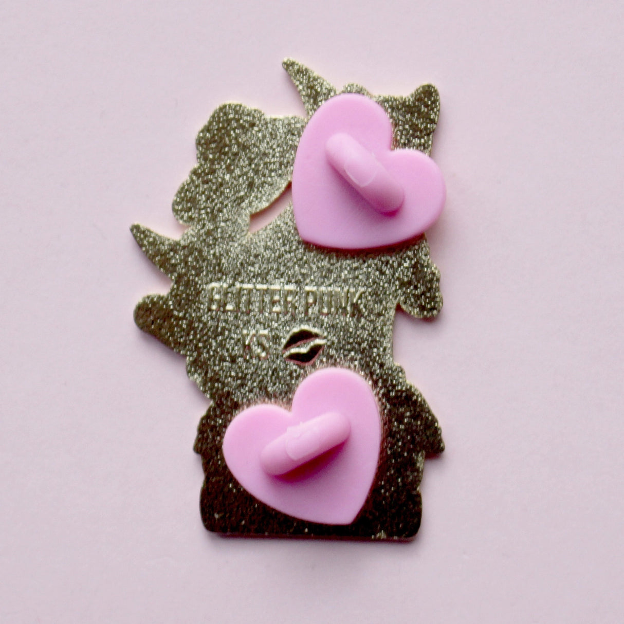 We’ve all sometimes wished we were at home with a hood book, rather than having to deal with the real world! This super cute pin features a black cat sitting on pink & purple books with the slogan ‘I’d rather be reading’. Behind the cat is a large crescent moon and a pair of glittery pastel clouds.
Measurements: 45mm (1.77”)