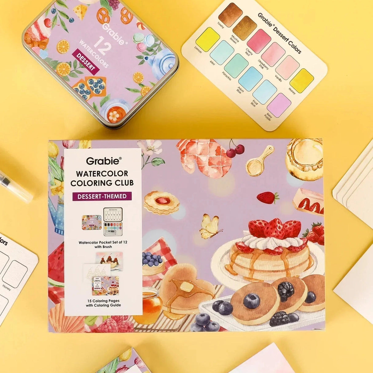 INDULGE YOUR CREATIVITY
Treat yourself to the sweetest watercolor adventure and build a colorful haven for your imagination. This delightful bundle comes with our custom 12-color Dessert palette and a whimsical coloring book featuring 15 pages of mouth-watering treats—from stacked pancakes and boba tea to elegant tiered cakes and delicate macarons. Bring these cozy, bakery-inspired scenes to life and watch your skills flourish!
A SWEET SETTING FOR CREATIVE ARTISTS
Embark on a delicious creative journey wit