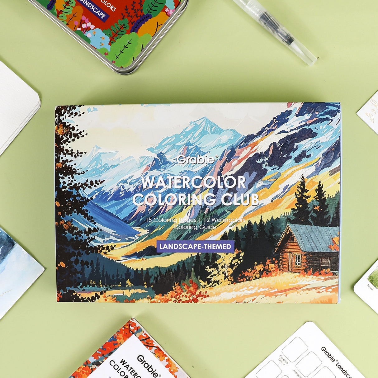 Grabie Watercolor Coloring Club Box - Landscape
A Landscape Coloring Journey – Perfect for nature lovers! This bundle includes a portable watercolor set and a beautifully illustrated coloring book, ideal for all skill levels. Enjoy a relaxing coloring experience.
Perfect Pairing for Nature Lovers – Thoughtfully designed, this set features a 12-color watercolor pocket set, curated with shades that capture the essence of nature, and a 15-sheet, 140LB landscape-themed watercolor coloring book.