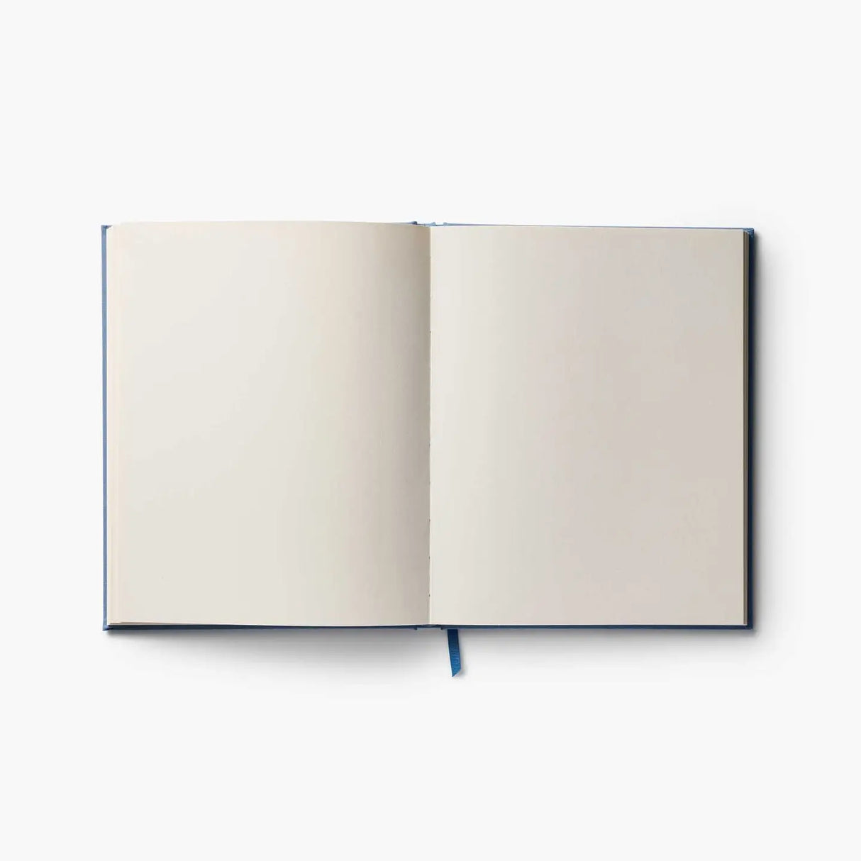 Our embroidered sketchbook is a large, hardcover journal with 108 unlined pages, perfect for sketching, drawing, and journaling. The cover is wrapped in blue book cloth and embroidered with our Gracie florals. Inside, an attached grosgrain ribbon bookmark will save your place.