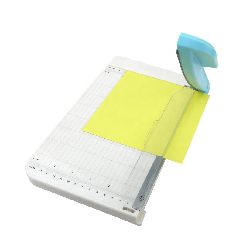 Built with a durable metal and plastic construction, this trimmer is perfect for craft rooms, classrooms, offices, and everyday projects. Its compact size makes it easy to store, while the sharp guillotine blade delivers smooth, straight cuts ideal for photos, cardstock, planner inserts, and more. Cleanly cuts 3 sheets of cardstock up to 9 inches.
Whether you're crafting, scrapbooking, or prepping materials for work, this cutter offers reliable performance in a convenient, easy‑to‑use design.