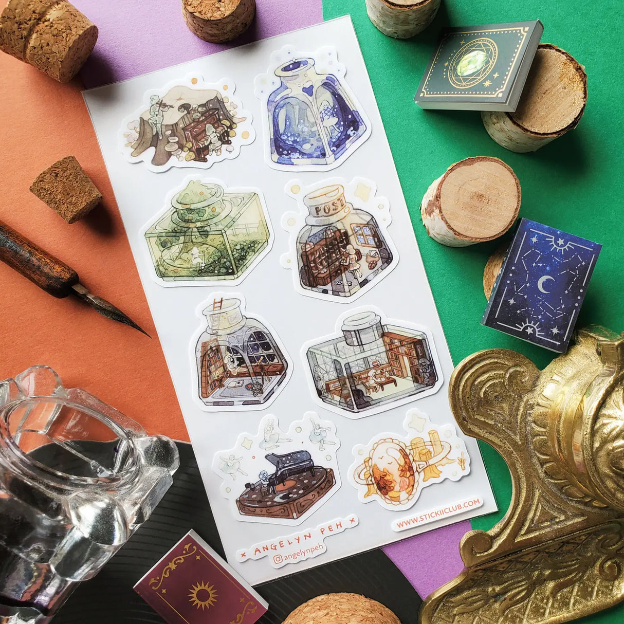 🖋️🎶 @angelynpeh invites you to explore a series of impossible little universes tucked away in jars and bottles! Whether it's a starlit concert hall, a mushroom musical, or a tiny library bathed in moonlight, every bottle feels like a miniature storybook scene waiting to be uncorked, and honestly? We want to shrink down and move in immediately.
Art by: @angelynpeh