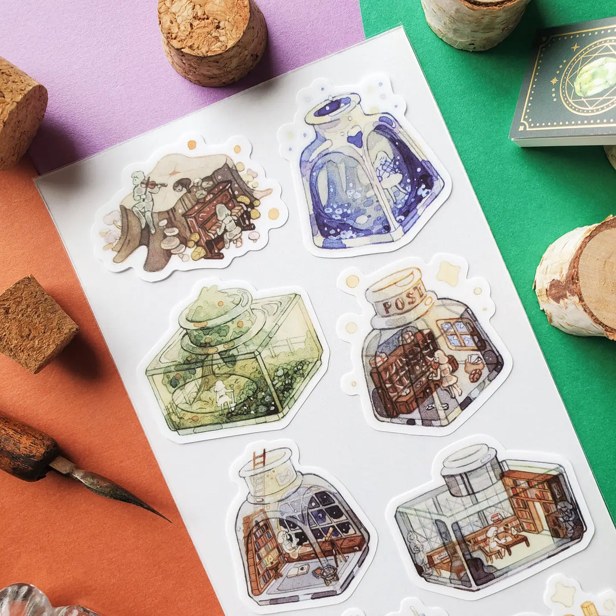 🖋️🎶 @angelynpeh invites you to explore a series of impossible little universes tucked away in jars and bottles! Whether it's a starlit concert hall, a mushroom musical, or a tiny library bathed in moonlight, every bottle feels like a miniature storybook scene waiting to be uncorked, and honestly? We want to shrink down and move in immediately.
Art by: @angelynpeh