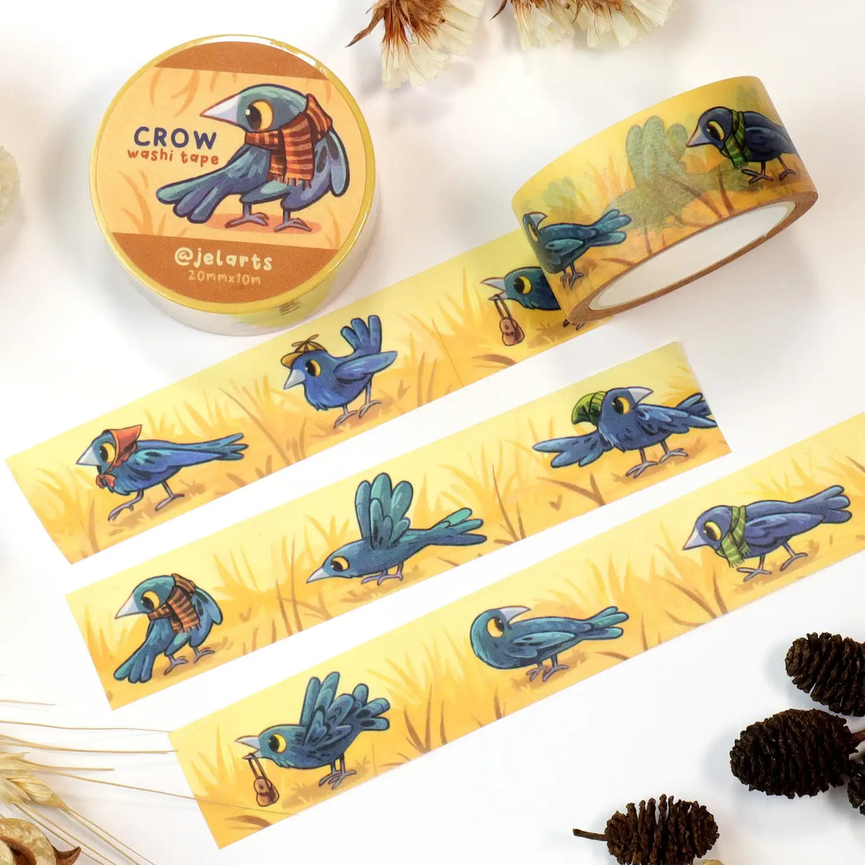 A bunch of crows wearing various accessories, on a roll of washi tape!
20mm wide x 10m length
Great for decorating journal spreads, sketchbooks, scrapbooks, and more!
Plastic wrapped with a label on one side