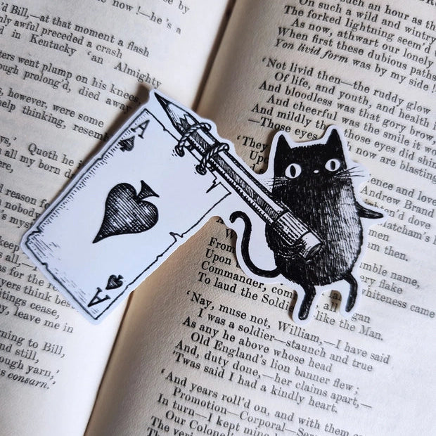A little sticker based on my friend Simon the black cat, flying his Ace flag, from my original pen and ink artwork.