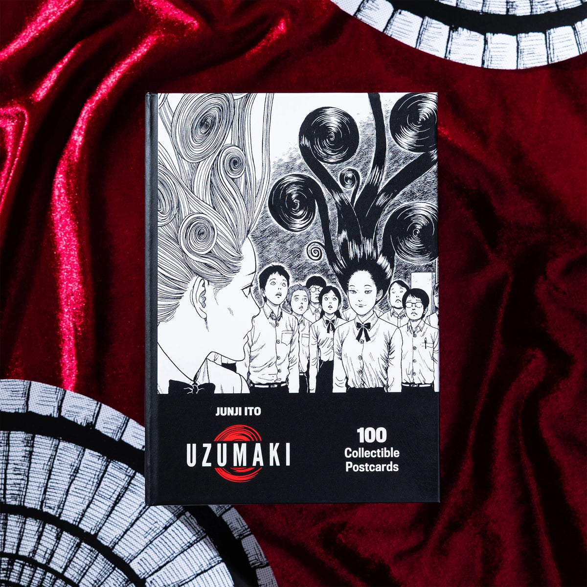 Spiral into horror with this deluxe, officially licensed set of 100 collectible postcards from legendary manga author Junji Ito. Each high-quality print showcases iconic artwork from Uzumaki, his bestselling manga series about a town cursed by spirals.
A four-time Eisner Award winner and New York Times bestselling author, Junji Ito has inspired generations of readers and creators with his legendary works of cosmic horror.