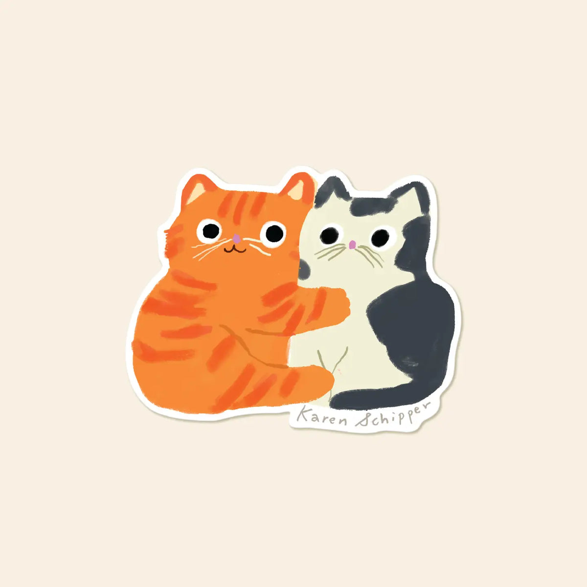 Karen Schipper Vinyl Sticker - Cat Hug
Some stickers say it all without a single word. Cat Hug Sticker features two cuddling cats — an orange tabby wrapping an arm around a black-and-white friend — making it a cute cat sticker that instantly feels warm and giftable.
Made from matte-coated, waterproof vinyl, it’s durable enough for laptops, planners, water bottles, and more. It’s an easy impulse add-on for cat people, best friends, and shoppers looking for a small but meaningful gift.
Measures appro