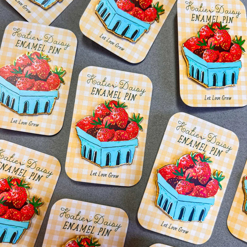 Strawberries Enamel Pin by Katie Daisy
A tiny treasure to pin on your jacket, tote, or favorite old flannel—each one a little love letter to country delights, small joys, and the art of noticing.