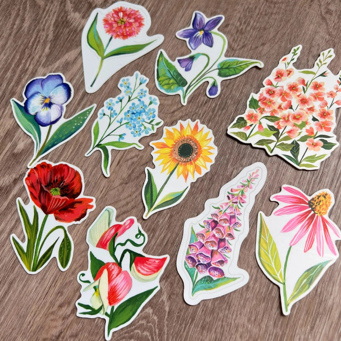 Wildflower Sticker Pack - Set of 10 Matte Stickers by Katie Daisy
From The Garden of Katie Daisy:
Adorn your laptop, water bottle, packages and so much more with this set of vibrant wildflower STICKERS!! You'll receive 10 floral stickers in a seed packet! (This listing is not for wildflower seeds ;) )