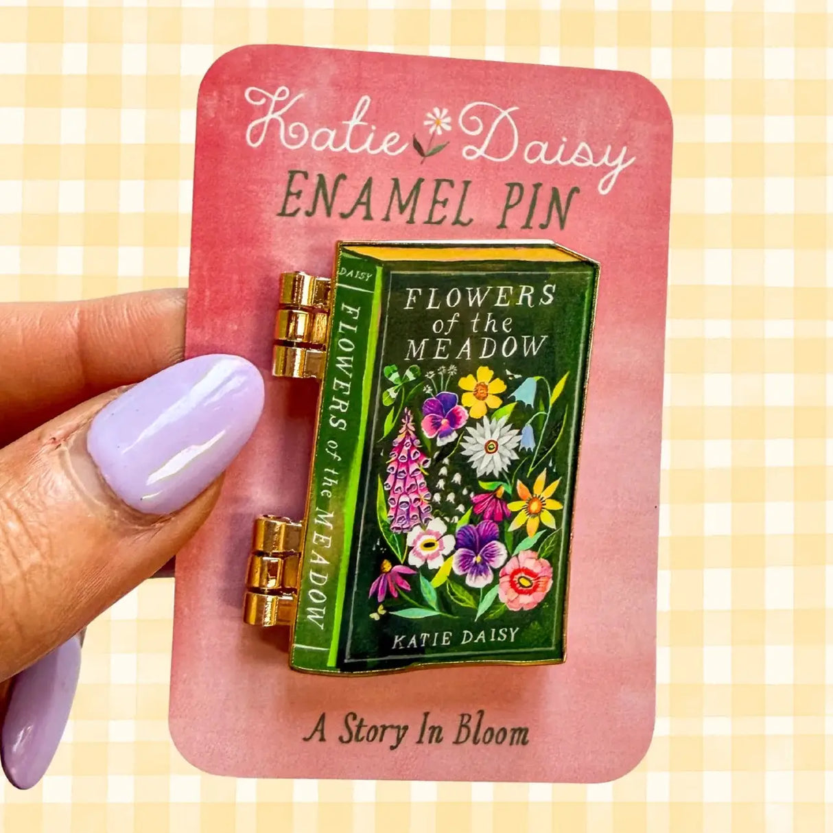 A tiny treasure for book lovers, wildflower wanderers, and collectors of small beautiful things.
This interactive enamel pin features a working hinge that allows the miniature book to open and close, revealing a hidden floral spread inside. Inspired by beloved vintage books and meadow blooms, it’s a little story you can wear on your jacket, tote, sweater, or favorite old flannel.
Details:
• 1.75” on the longest side
• Interactive hinged design that opens like a tiny book
• Gold-plated finish
• Rich, detail