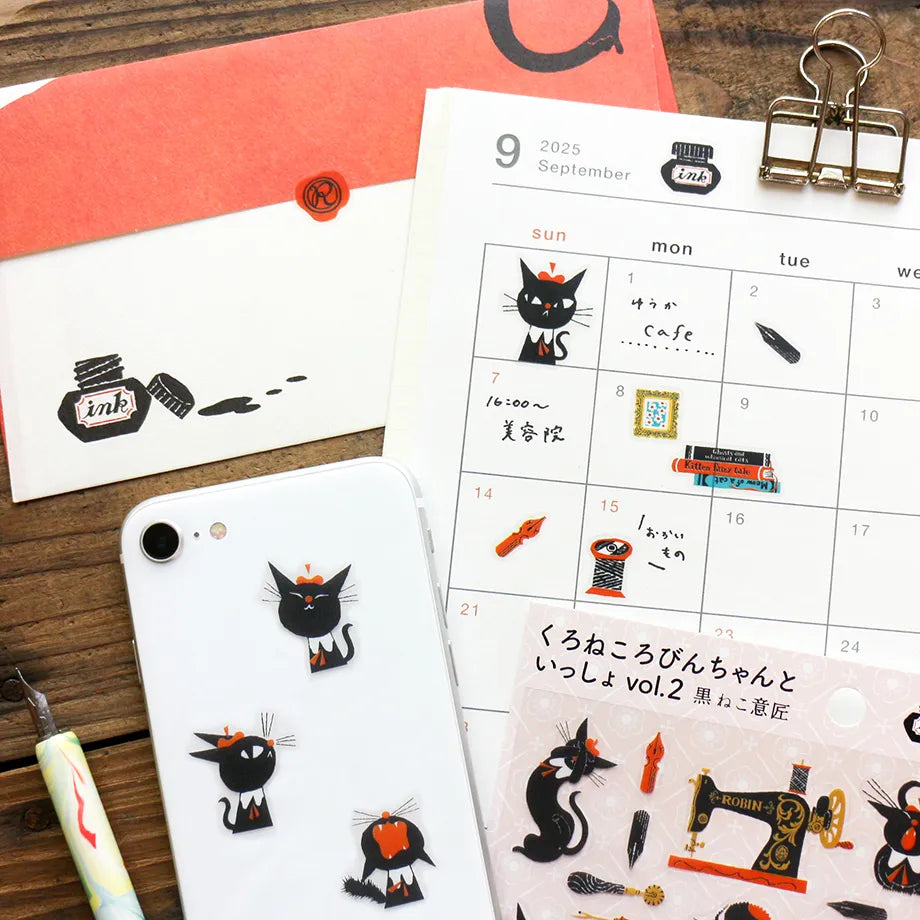 A sticker featuring a stylish black cat named 'Robin-chan' as the main character.
Robin-chan's pose, which gives off the unique softness of cats, is irresistibly cute.
The sewing machine, sewing kit, pen nibs, ink, sealing stamps, and other stylish items lined up are also stylish.
Printed on PET material, the stickers have a smooth, durable finish that’s easy to peel and place - great for both everyday use and special projects.
✨ Product Details
Smooth, durable PET sticker material
Perfect for planners,