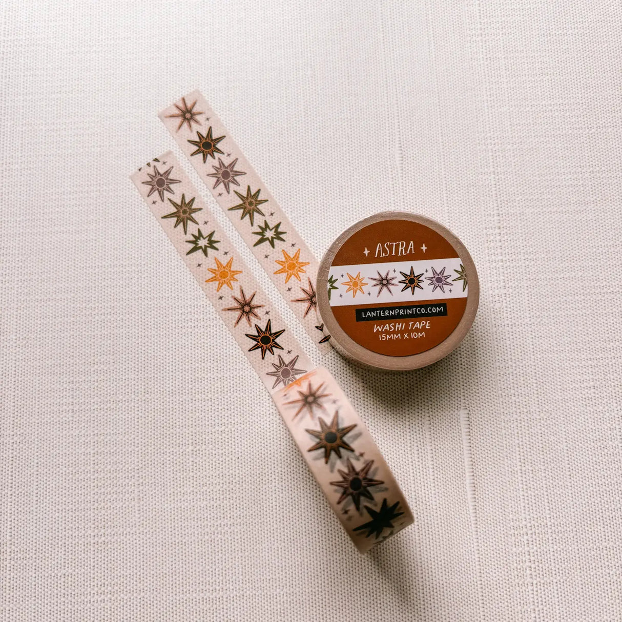 Removable Washi craft tape for journaling and gift wrapping; featuring whimsical celestial stars on a cream background.
15mm x 10m
Shrink wrap packaging with label