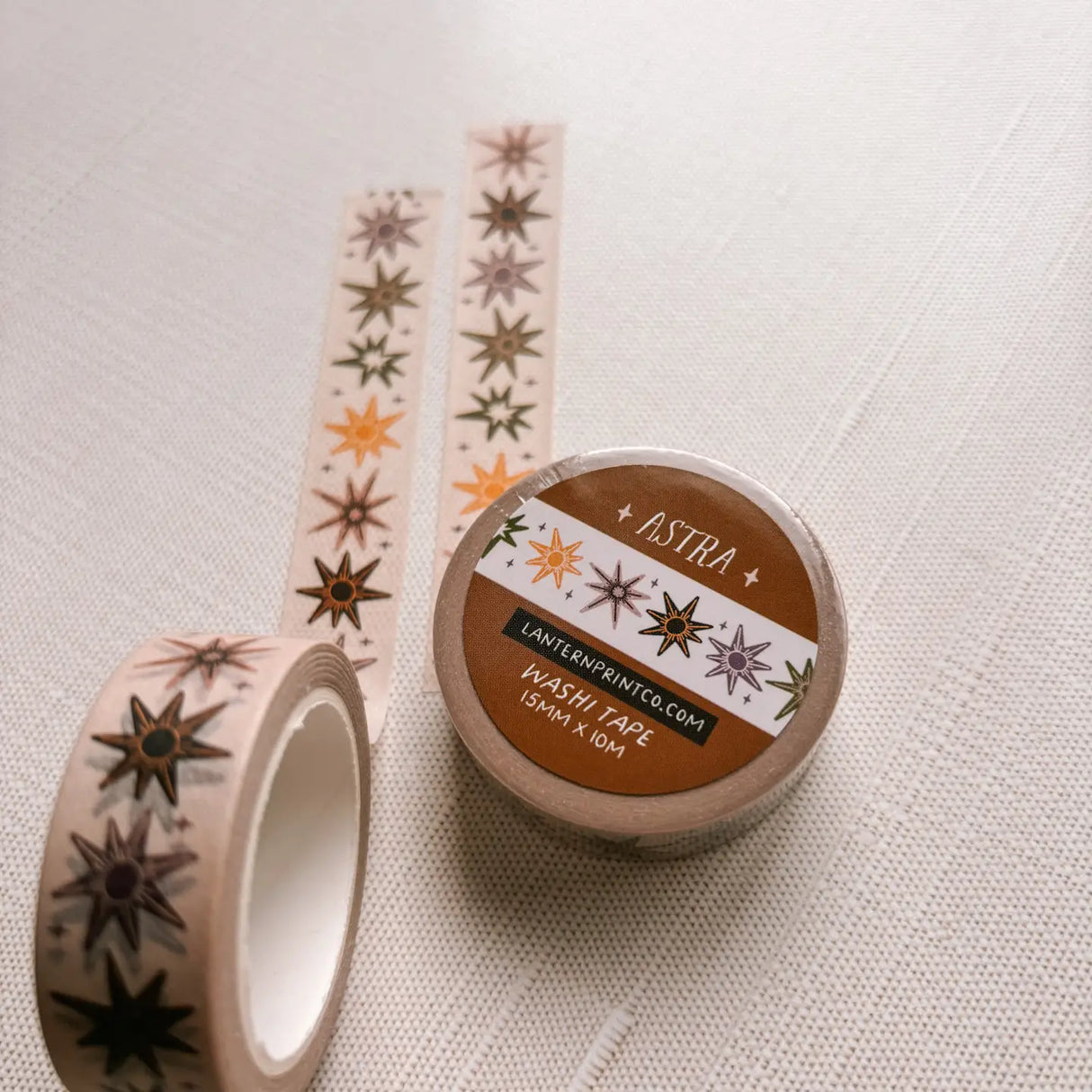 Removable Washi craft tape for journaling and gift wrapping; featuring whimsical celestial stars on a cream background.
15mm x 10m
Shrink wrap packaging with label