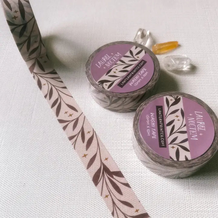 Removable Washi craft tape for journaling and gift wrapping; featuring laurel leaves and stars.
15mm x 10m
Shrink wrap packaging with label