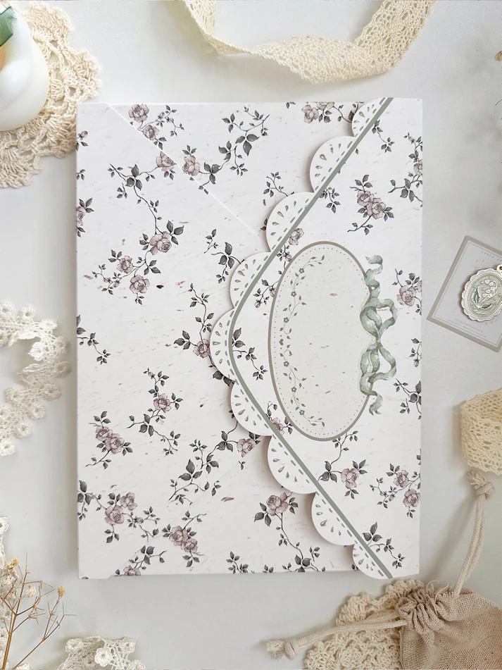 lily of the valley fabric notebook cover. sewn together with careful craftsmanship. lined with lace ruffles for that extra romantic, cottage-core, fairytale touch. meant to protect your notebooks & a keepsake for your beloved stationery :)
♡ floral linen pattern with ruffle lace edging & lily of the valley embroidery
♡ lace ribbon enclosure to help keep your notebooks closed
♡ 7 pockets total (left sleeve: 5 pockets | right sleeve: 2 pockets)
♡ x1 lace ribbon book mark with gold bow pendant