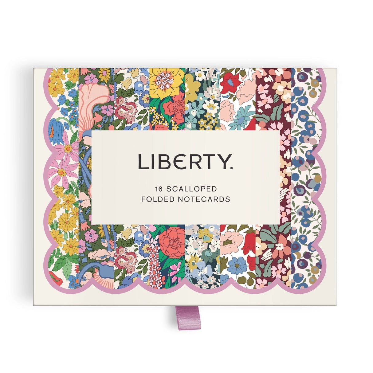 Elevate your correspondence with the Liberty Premium Notecard Set. This elegant collection features 16 folded notecards showcasing 8 distinctive iconic Liberty London designs. Each card is finished with delicate die-cut scalloped edges that add a refined touch to every note you send. The set includes full-color envelopes lined with charming floral patterns, bringing beauty to every detail. Presented in a premium drawer box with a sturdy ribbon pull, this notecard set makes a sophisticated gift or a treasure